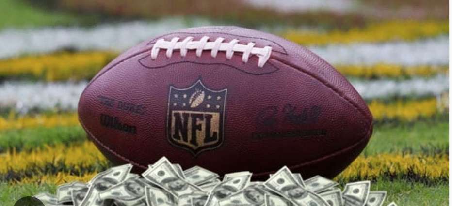 Football on field with money