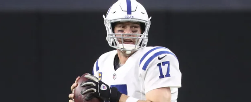 Philip Rivers preparing to throw a football