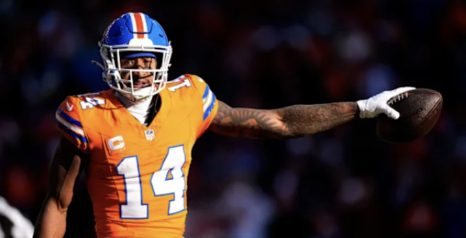 Courtland Sutton with football and arm out