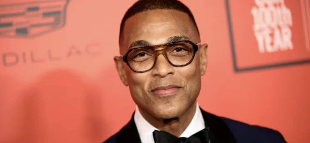 Don Lemon with light red backdrop