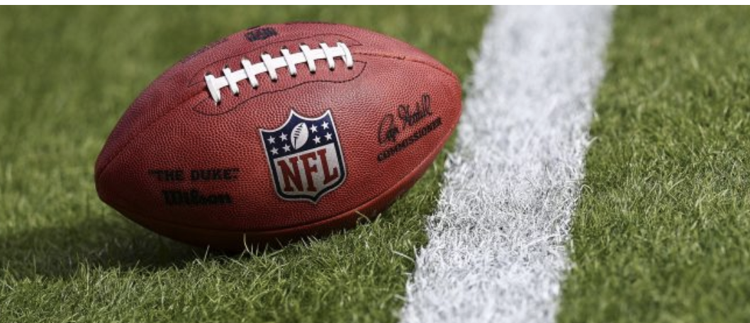 Football on field between yards