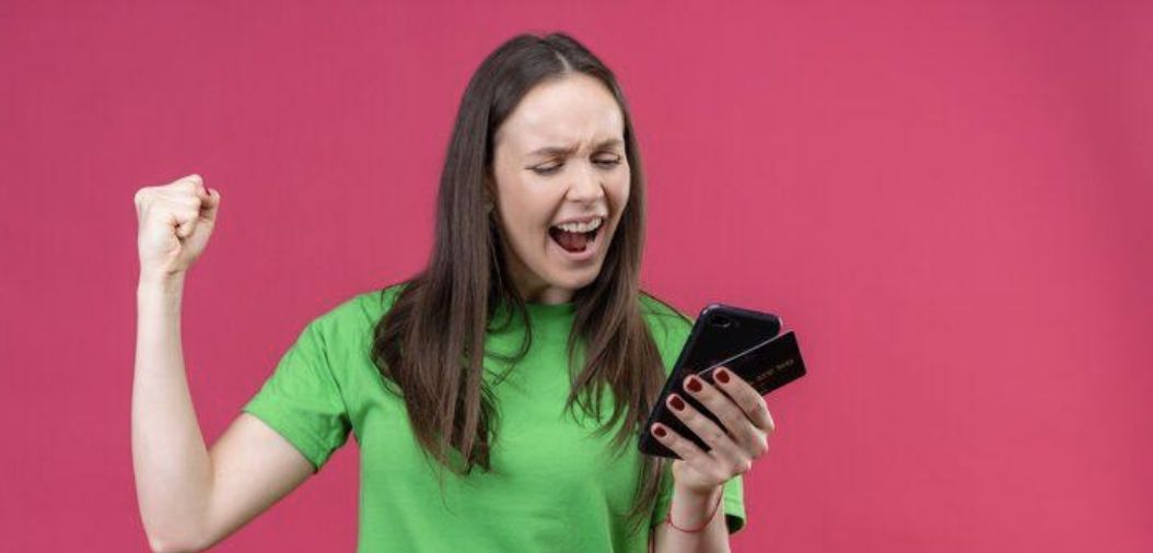 Woman celebrating on her phone