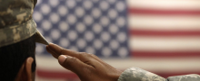 US soldier saluting the flag