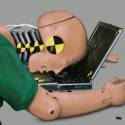 Crash test dummy at laptop
