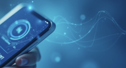 Phone being held in blue backdrop