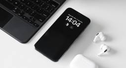 mobile phone next to computer