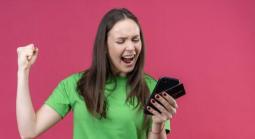 Woman celebrating on her phone