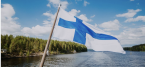 Finland flag and landscape in background